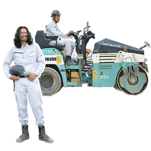 作業着を着た二人の男性が写っている